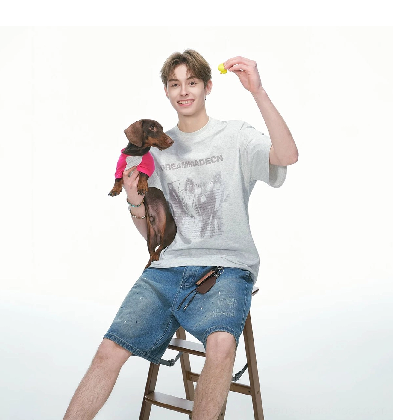 White Flower Gray vintage graphic oversized T-shirt styled with denim shorts in a relaxed casual streetwear photoshoot