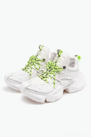 Pair of white futuristic 3D-printed platform sneakers with neon green braided laces, matching heel pull tabs, and chunky serrated streetwear soles