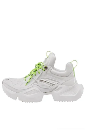 Side profile of a white futuristic platform sneaker with mechanical-inspired panels, neon green laces, heel pull tab, and textured chunky outsole