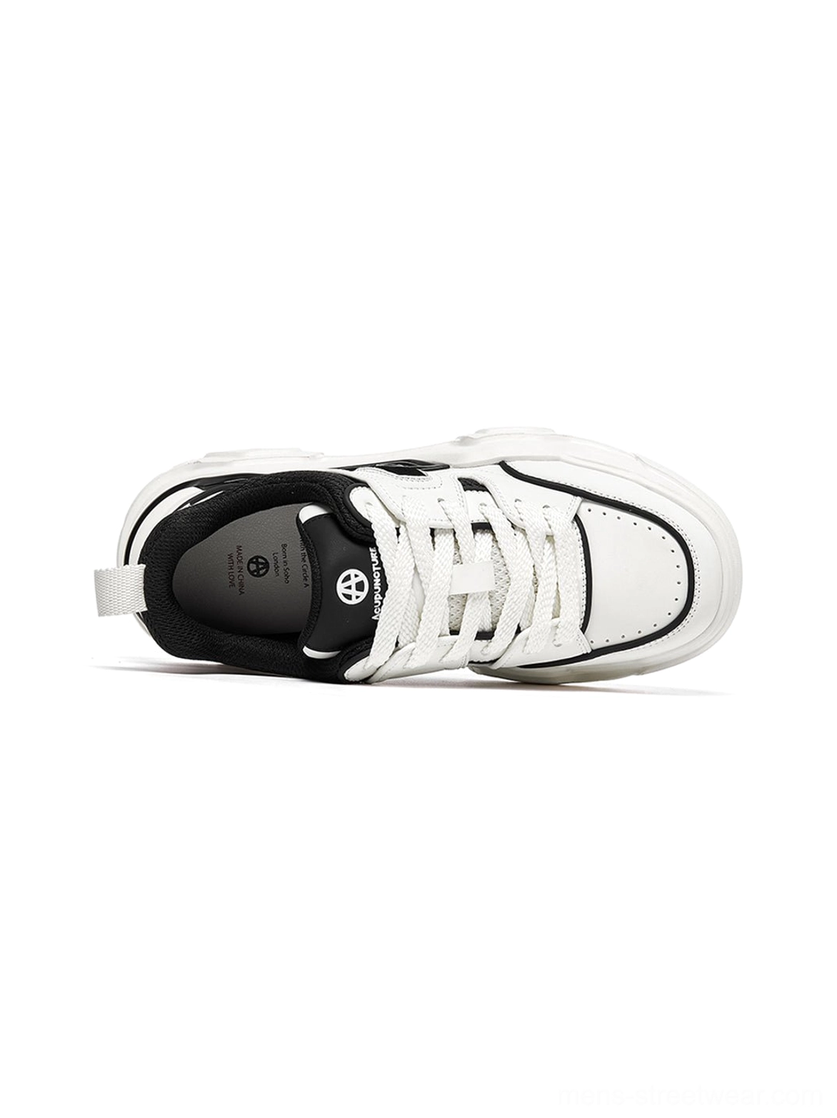White geometric cutout platform sneaker isolated display highlighting negative space design elements and architectural innovation