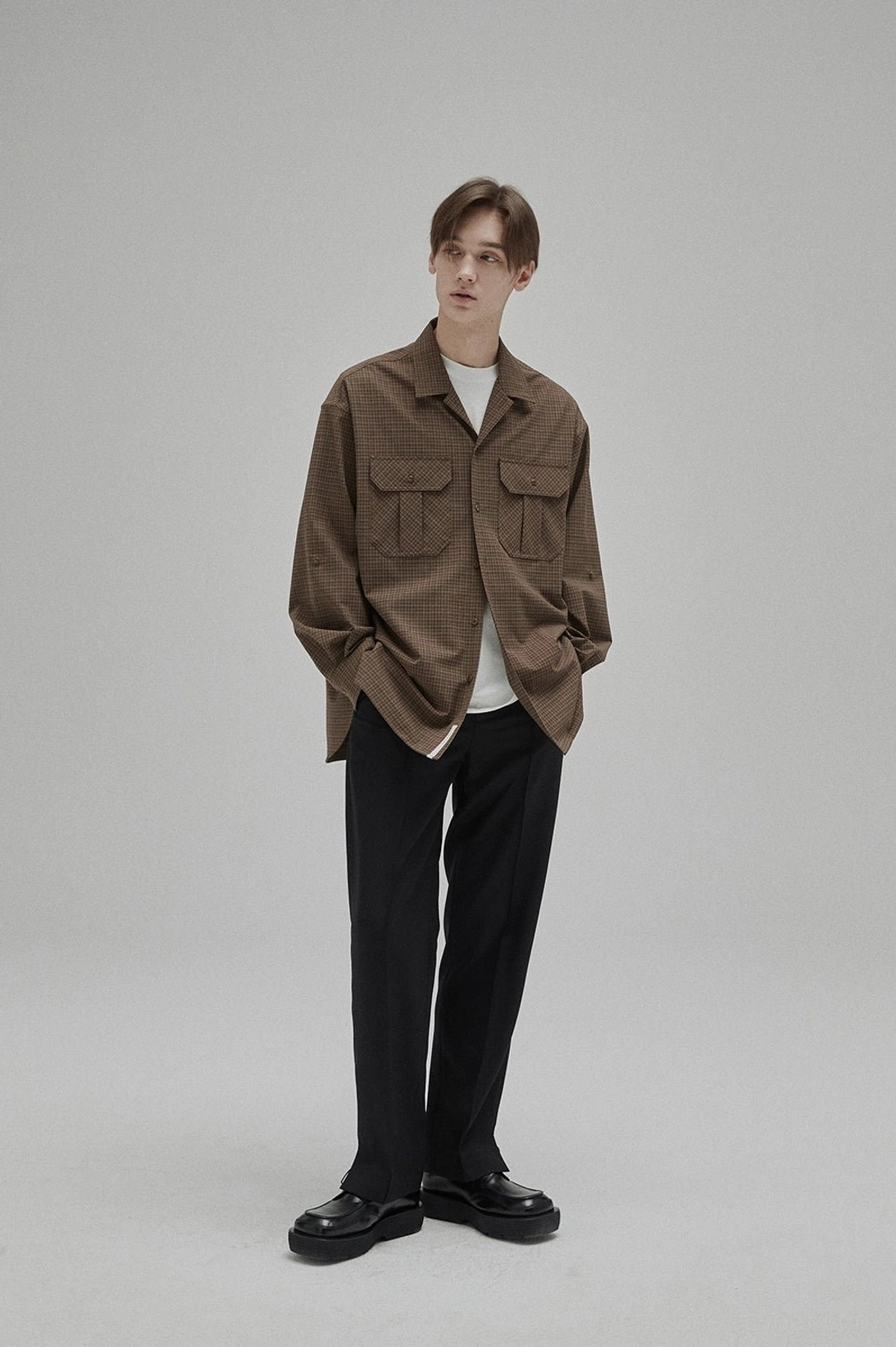 White GIZA cotton crew neck T-shirt worn beneath a brown textured work shirt with black tailored trousers