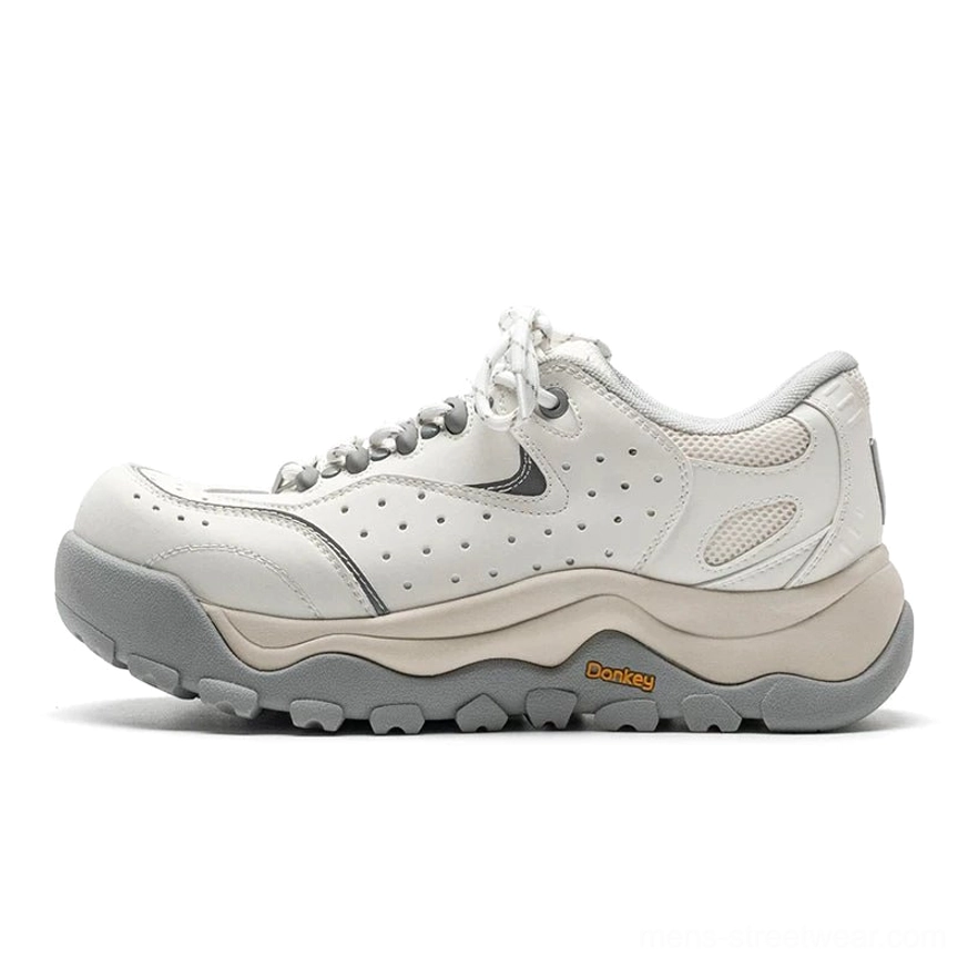 White gray Terrain Crest chunky trail sneakers in side profile with perforated upper panels, layered construction, and rugged gray rubber outsole