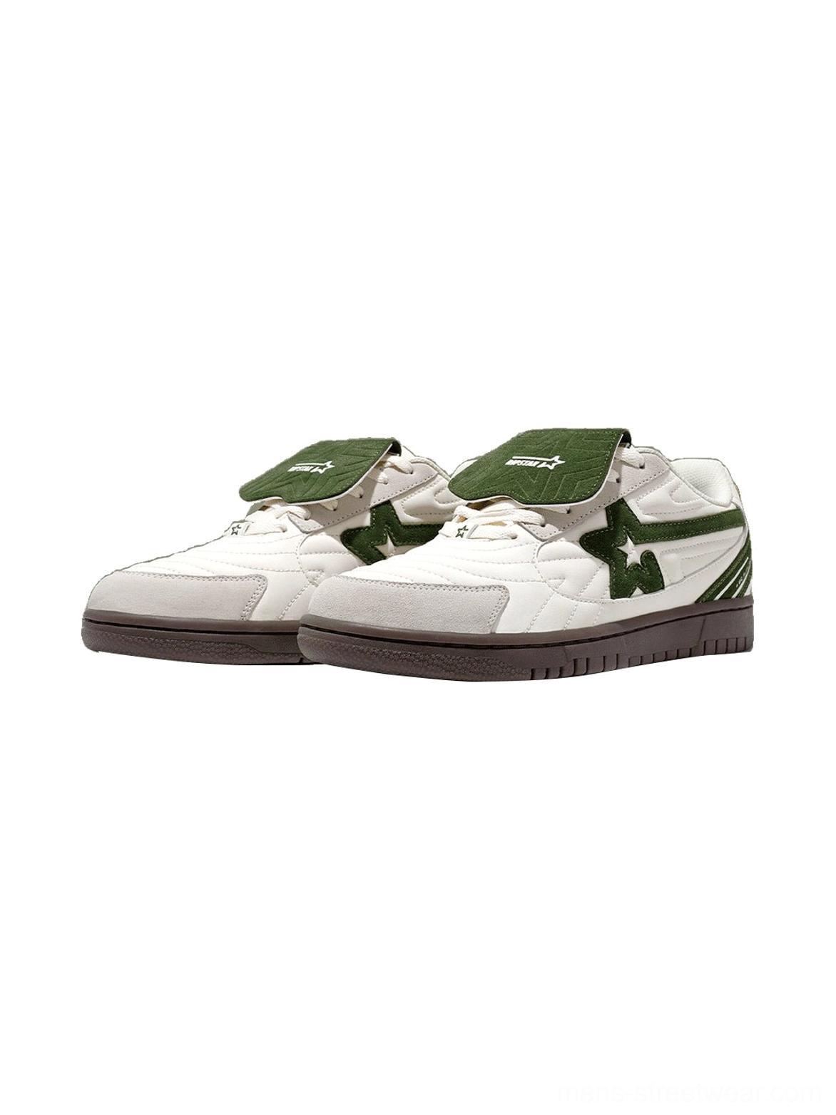 Pair of white green detachable tongue low-top sneakers displayed from the front side with matching star details and layered panels