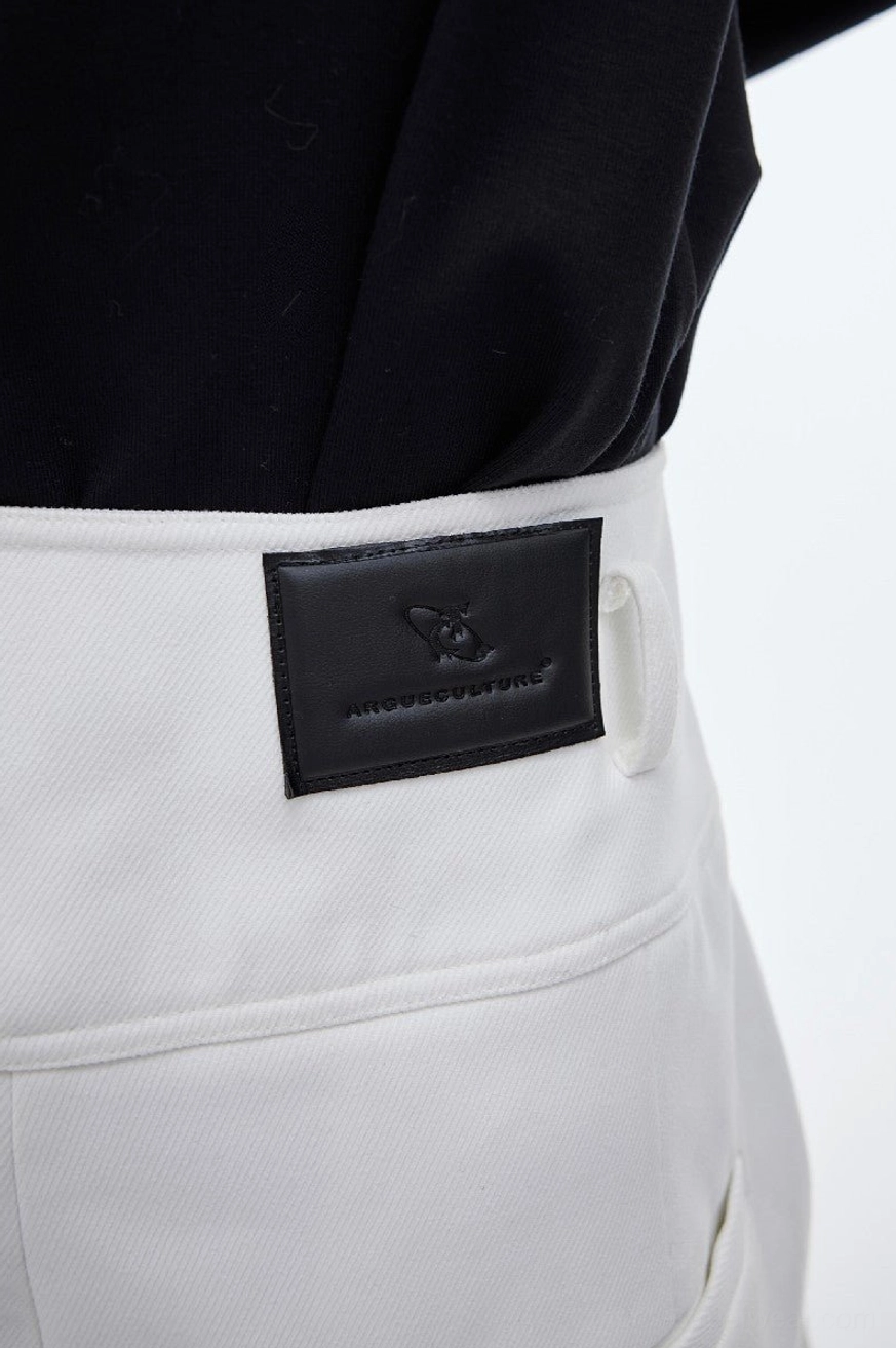 Close-up of white high-waist wide-leg trousers showing cotton twill fabric belt loop waist sash back pocket seam and logo patch