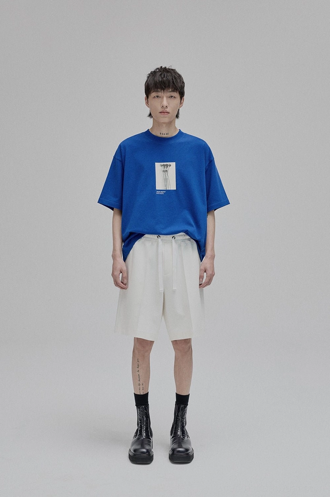 White lace-up straight leg tapered ankle shorts alternative angle close-up fabric detail streetwear casual wear