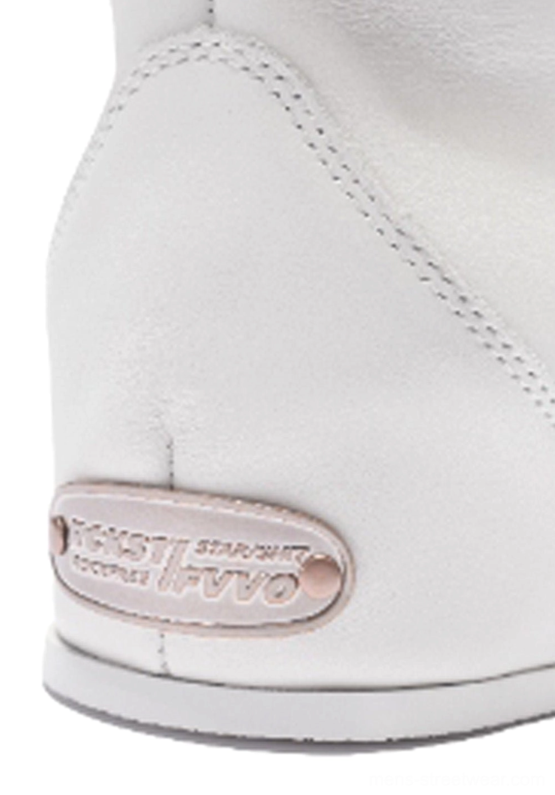 Close-up rear heel detail of white leather high-top boot showing metal heel plate, stitched collar, and sculpted sole profile