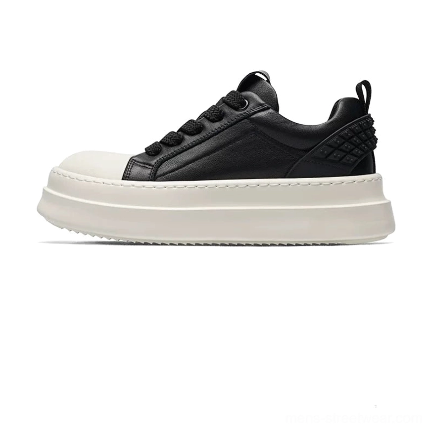 All-white leather platform low-top sneakers in side profile with smooth upper, thick sole, and quilted heel detail