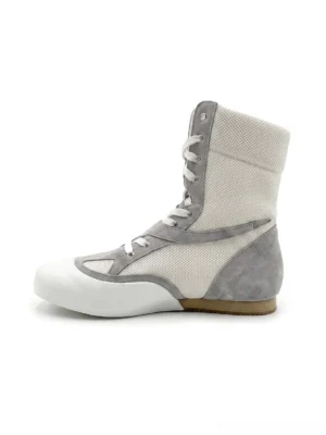 White and light gray mesh boxing boots with metallic streetwear overlays, high lace-up ankle design, rounded toe, and low flat sole shown in a three-quarter product view