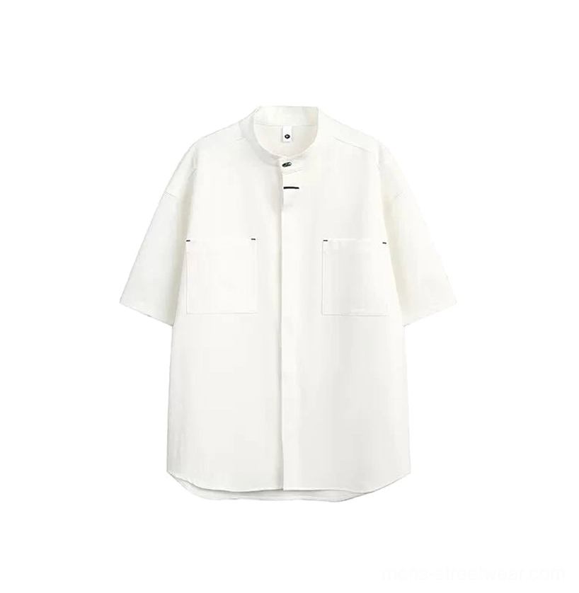 White mandarin collar oversized utility shirt with hidden button placket and large chest pockets front view