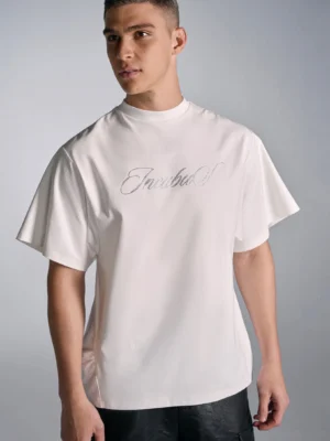 White men's graphic streetwear T-shirt with shimmering silver crystal script chest design, crew neck, relaxed oversized silhouette, and short sleeves