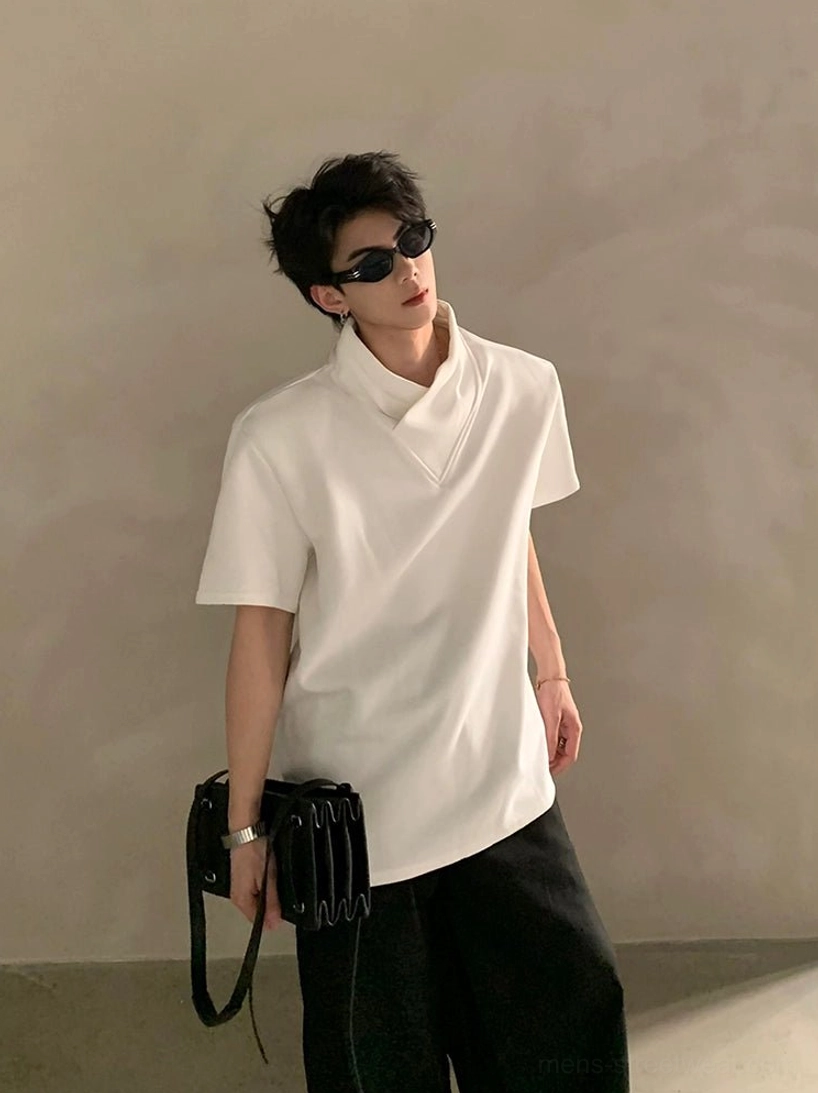 White minimalist layered high-collar short-sleeve streetwear shirt shown from side angle on male model