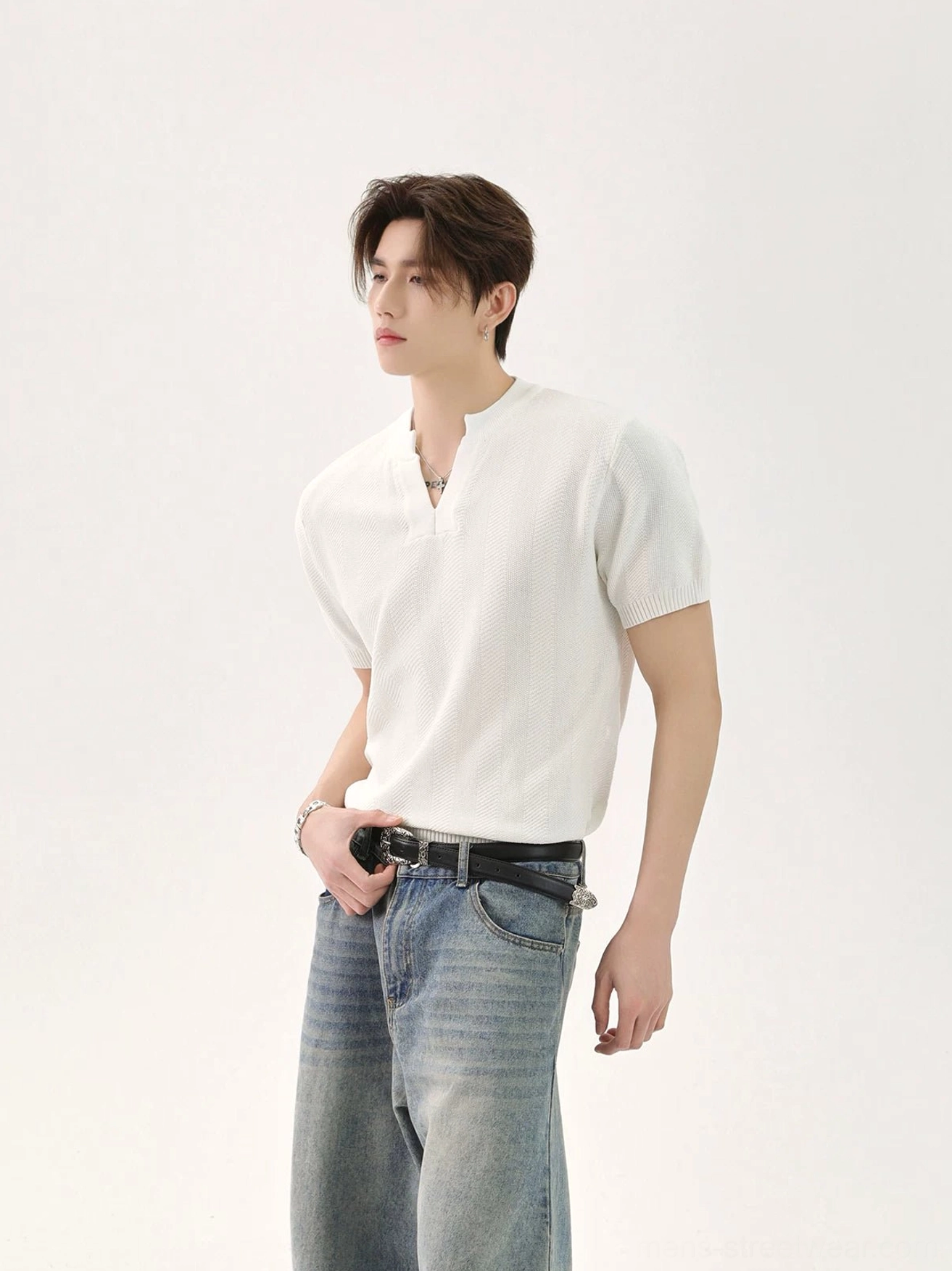 White minimalist V-neck knit T-shirt for men in relaxed casual fit left three-quarter view