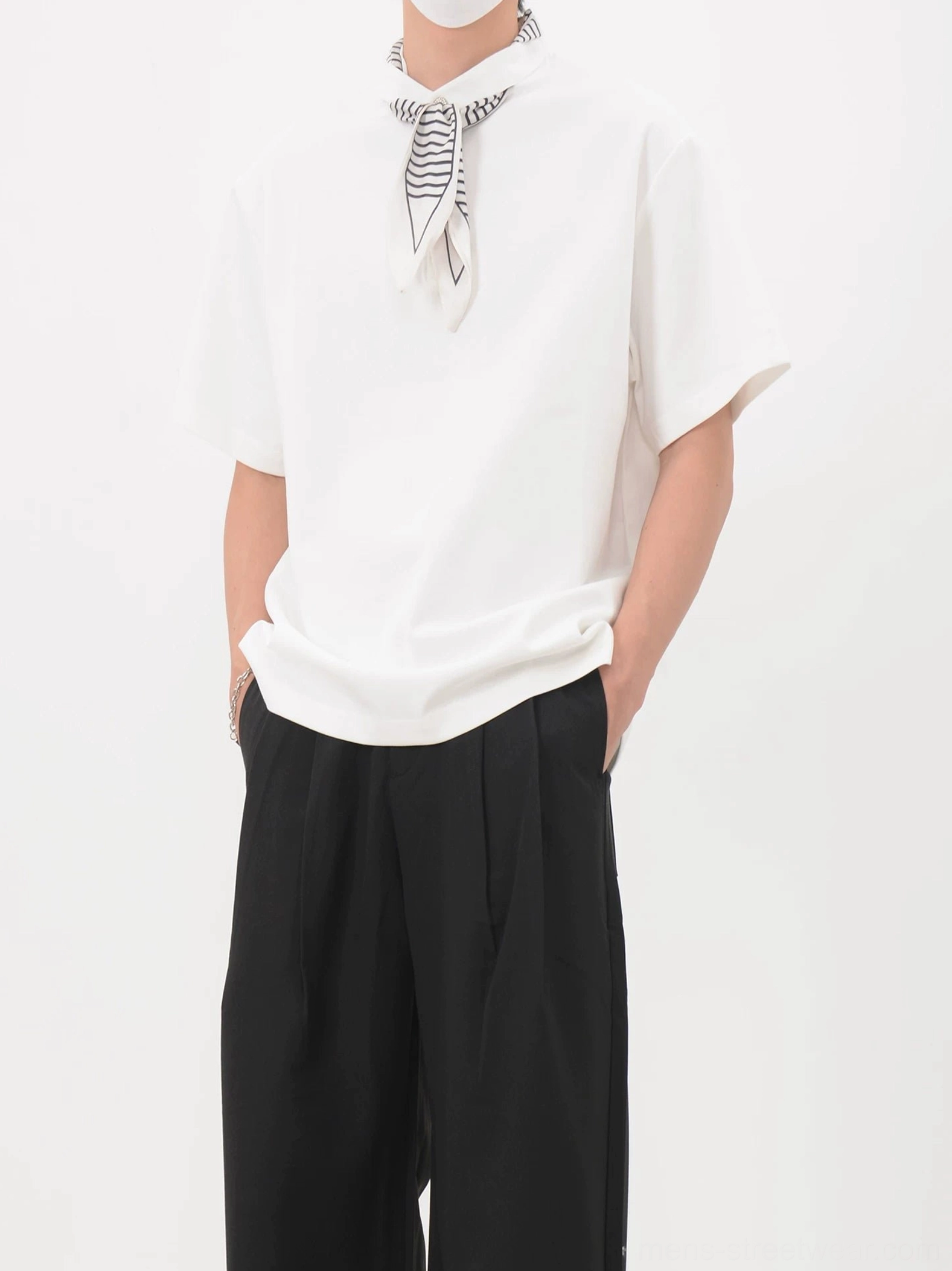 White oversized polo tee with neatly arranged striped bandana neckerchief shown in a clean Korean streetwear outfit