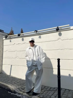 White oversized cotton poplin shirt with wide-leg trousers styled as a clean minimalist Seoul streetwear outfit
