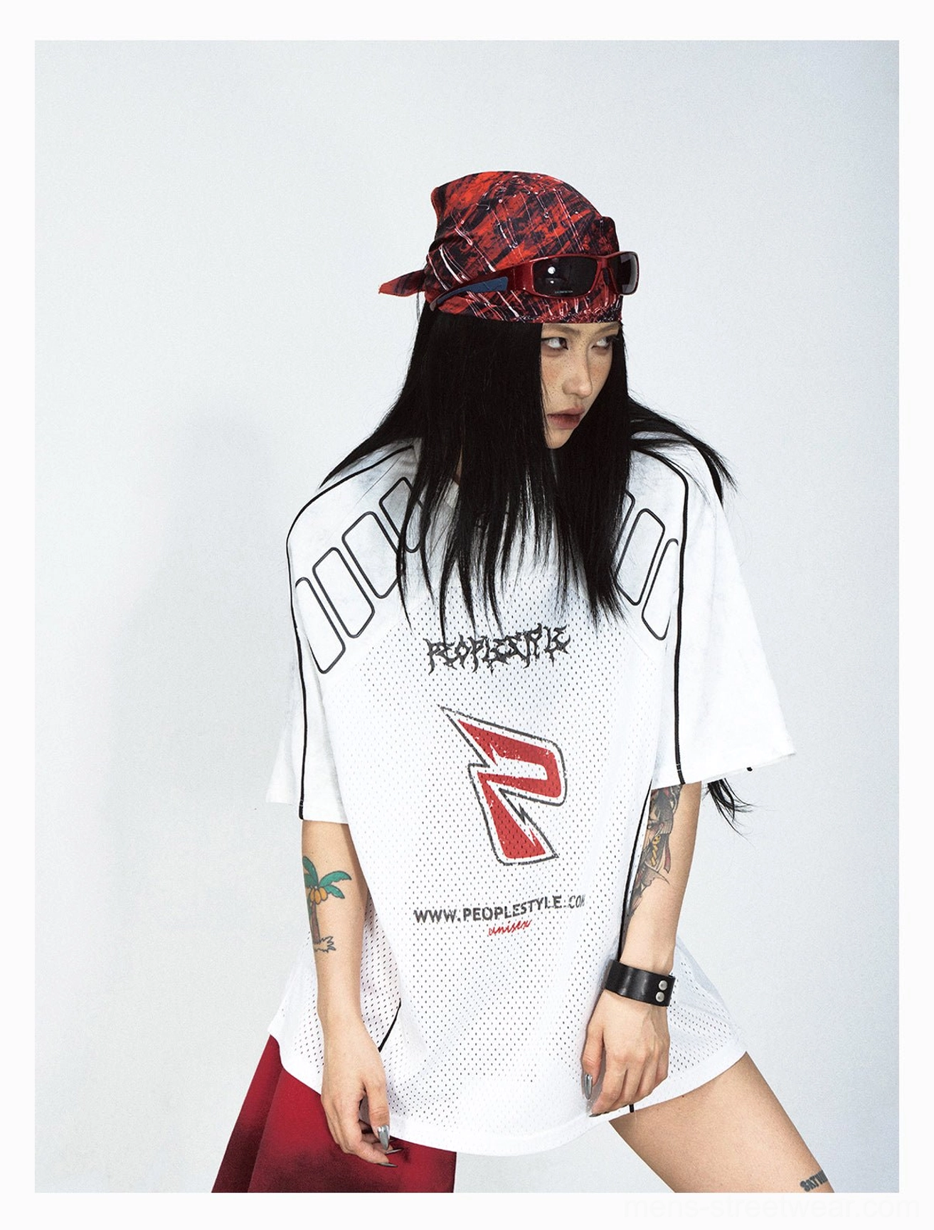 White oversized graphic mesh T-shirt shown from a three-quarter angle with red and black details and relaxed Korean street fashion fit