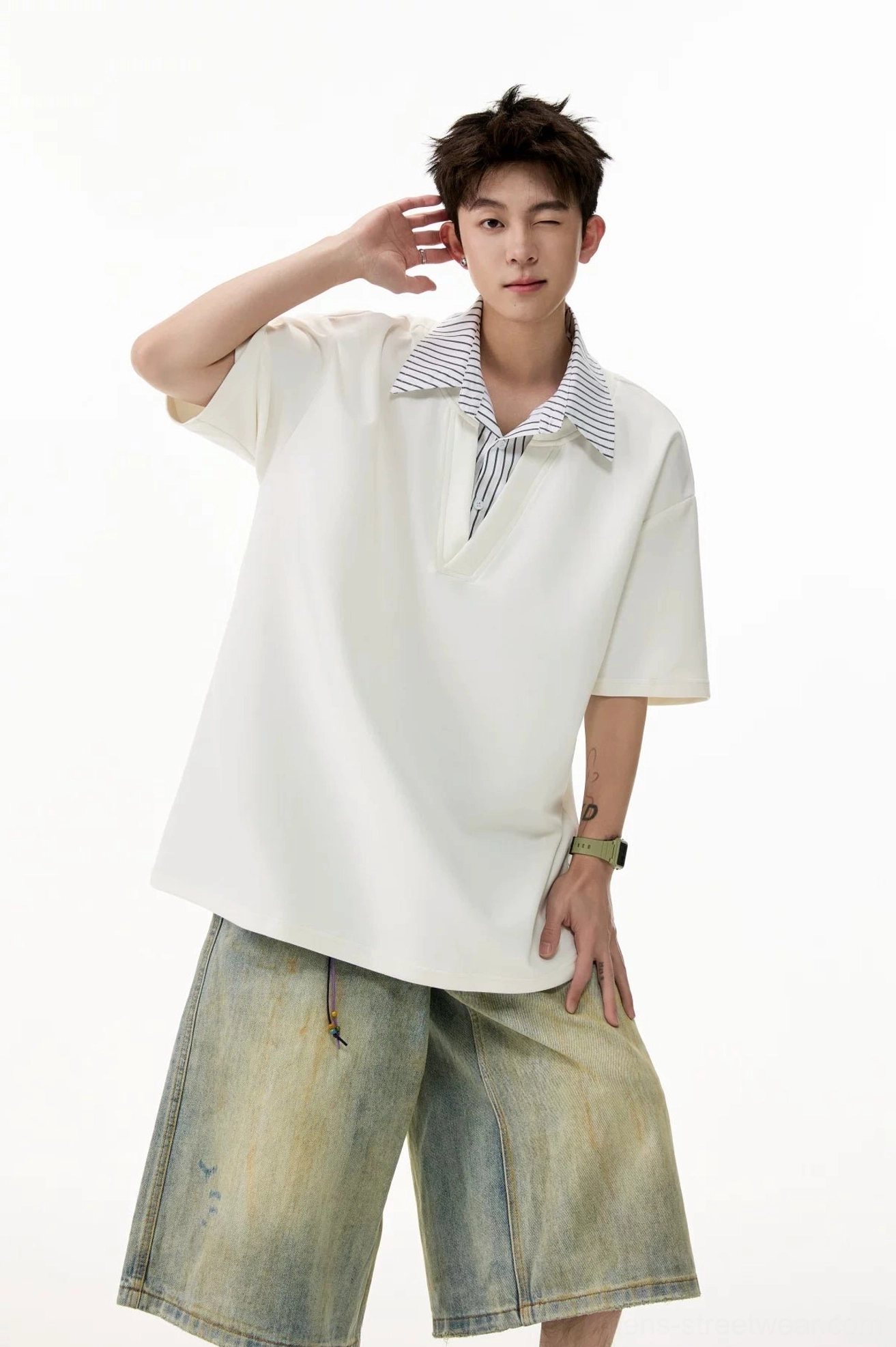White oversized V-placket polo T-shirt with striped layered collar styled with vintage washed denim shorts