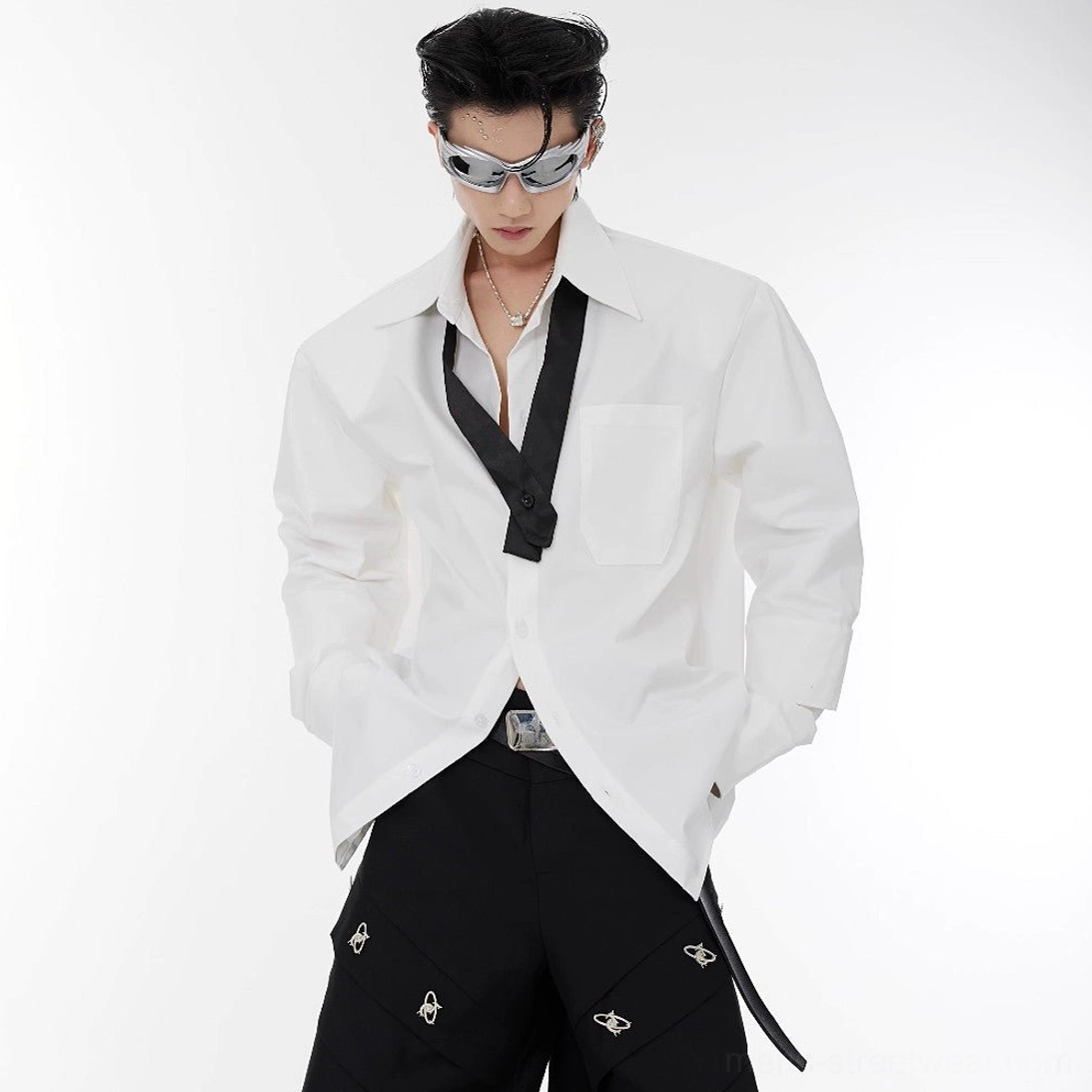White oversized shoulder pad tie-neck shirt front view with contrasting black neck tie and chest patch pocket