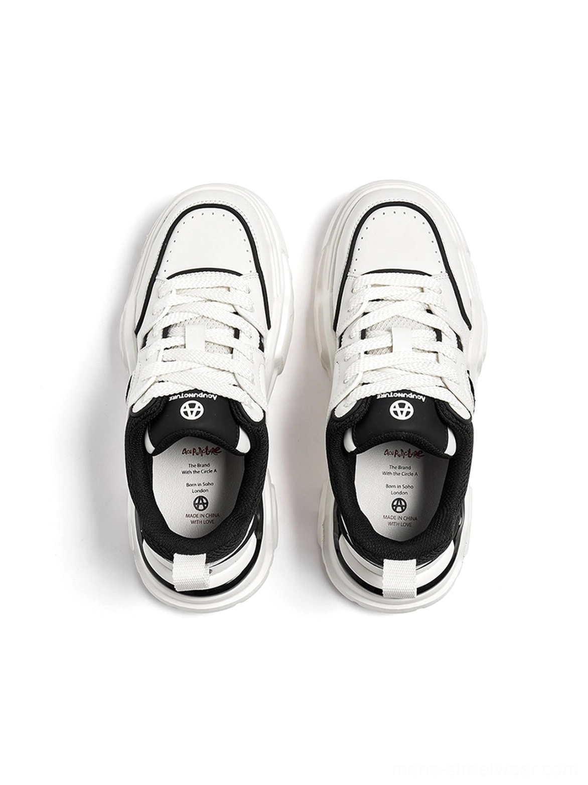 White platform sneaker detailed close-up showing stitching precision contrast threading and construction quality of cutout panels