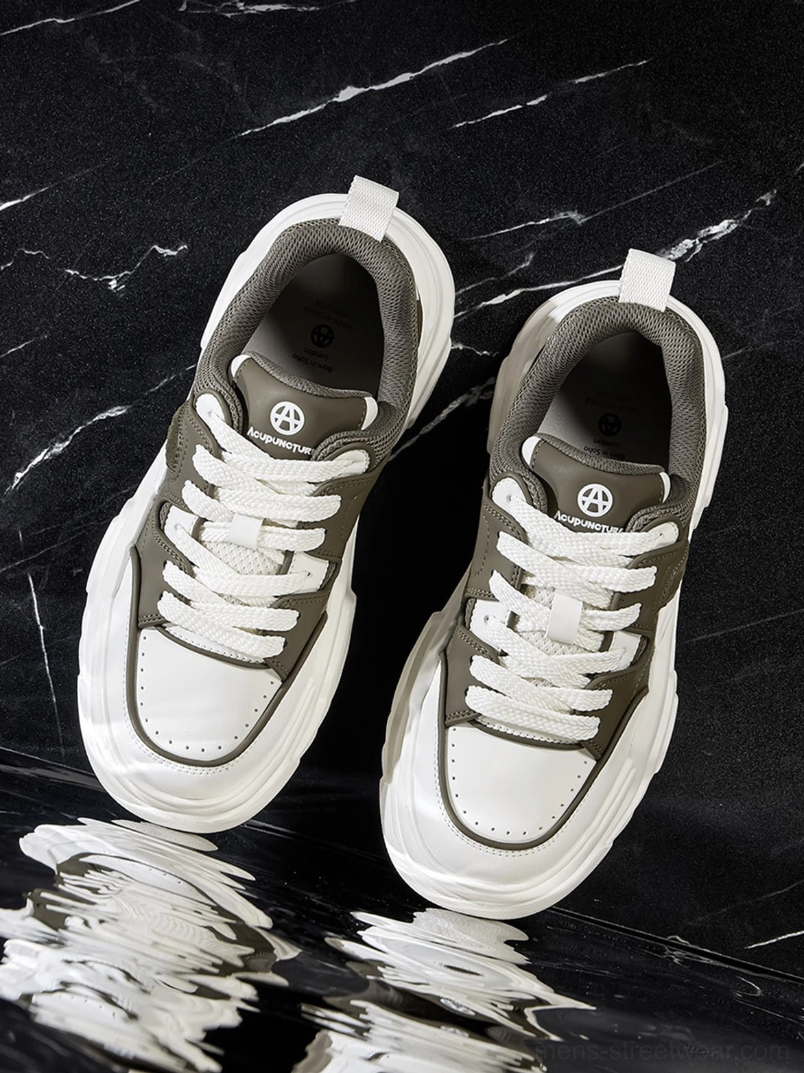 White platform sneaker side elevation view emphasizing lug sole tread depth and overall silhouette weight presence design statement