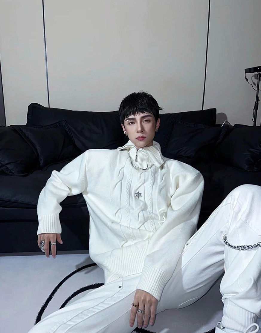 White relaxed cable knit streetwear sweater with star badge styled with chain-detail trousers