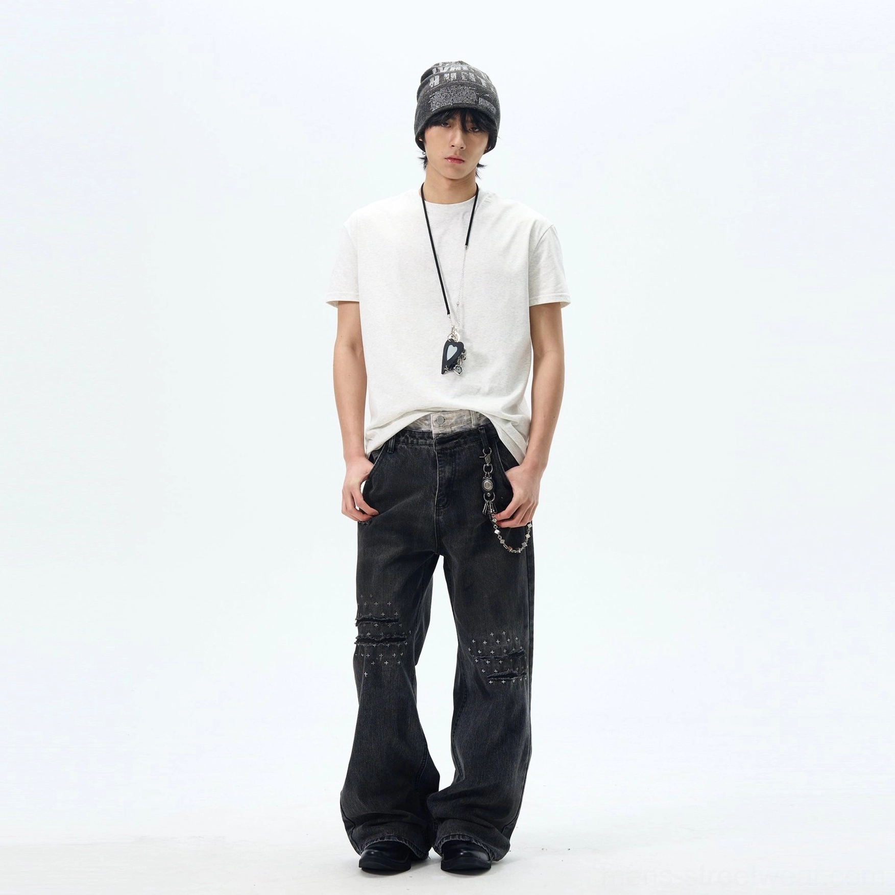 White relaxed crew neck t-shirt styled with a beanie, layered inner hem, pendant necklace, and wide-leg jeans