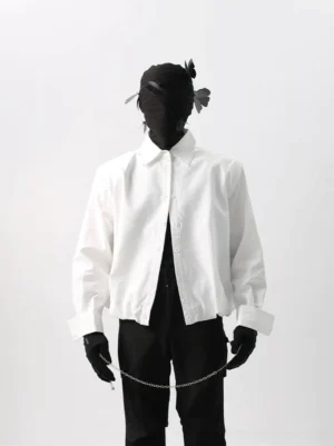 White relaxed cropped cotton poplin shirt styled with black wide-leg trousers in a Korean streetwear studio outfit