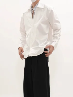 White relaxed fit long-sleeve button-front shirt with pointed raised collar and curved hem full body streetwear outfit