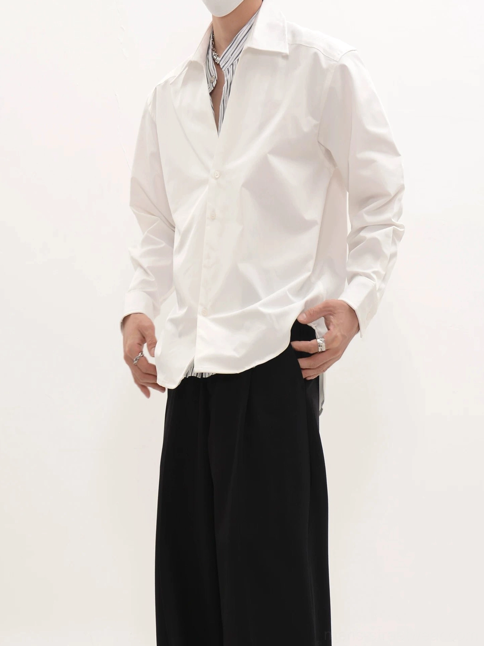 White relaxed fit long-sleeve button-front shirt with pointed raised collar and curved hem full body streetwear outfit