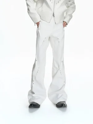 White rivet sculpt flare denim pants front full body view styled with cropped white jacket and leather shoes