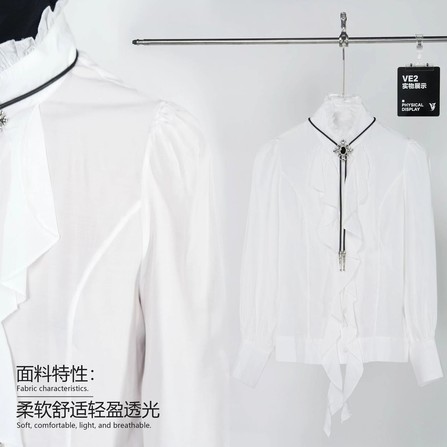 Close up and hanging product view of a white ruffled stand collar cravat blouse with front placket, metal chain ornament, puff long sleeves, and matching tie
