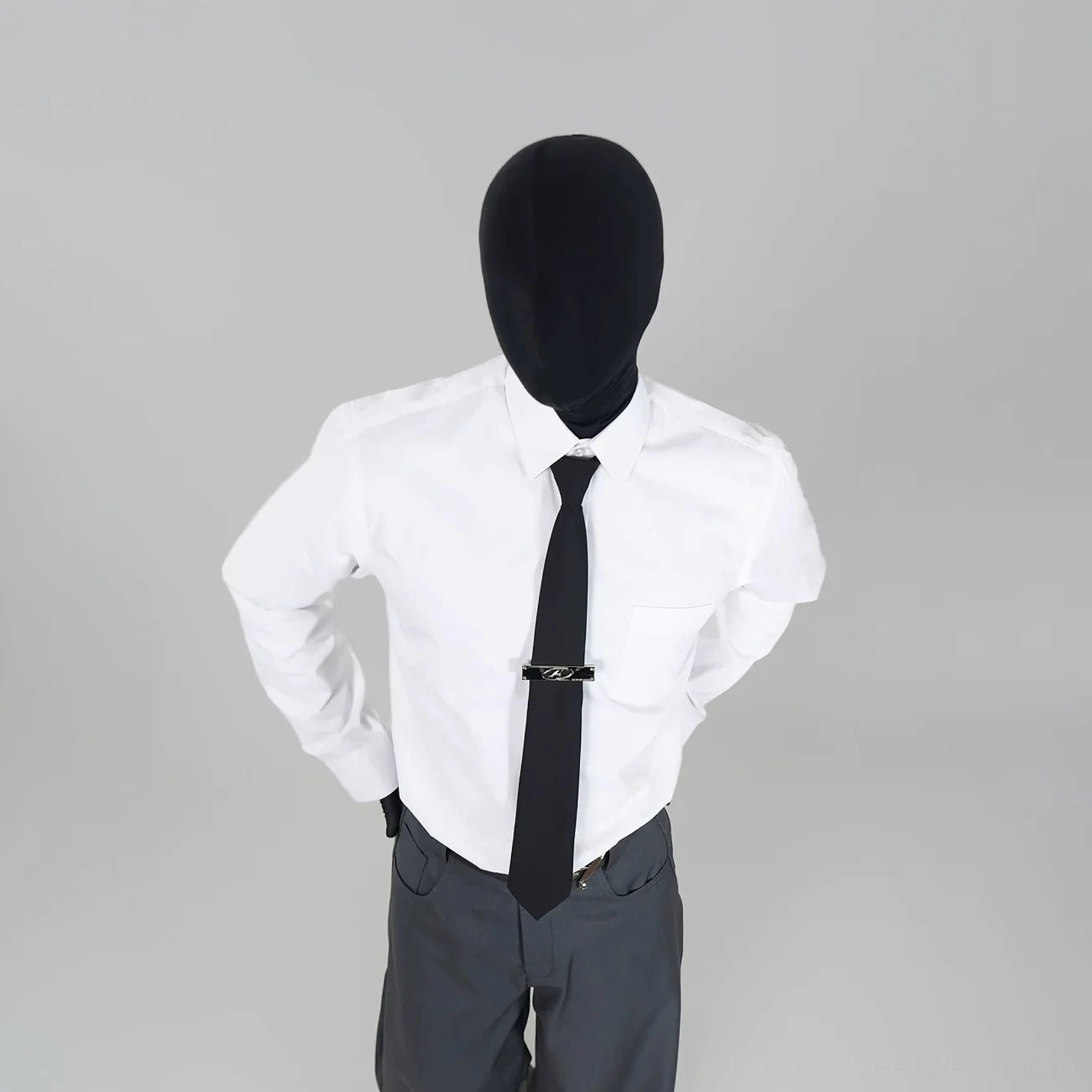 White satin-finish dress shirt with structured collar styled with a black necktie and dark tailored trousers