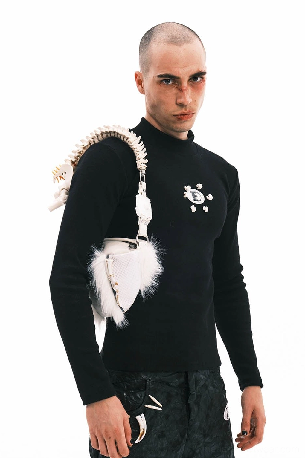 White sheepskin fur shoulder bag with polished silver hardware and sculptural faux bone spine handle