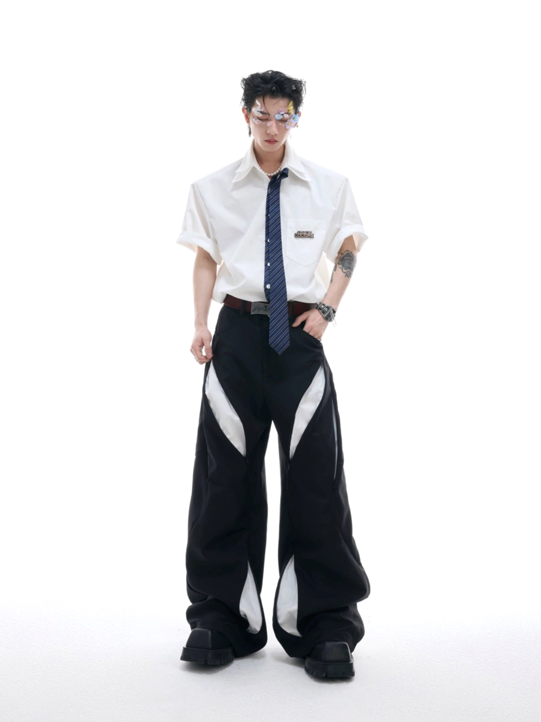 White short sleeve shirt with dark blue solid necktie and wide leg trousers in a full body Korean streetwear outfit