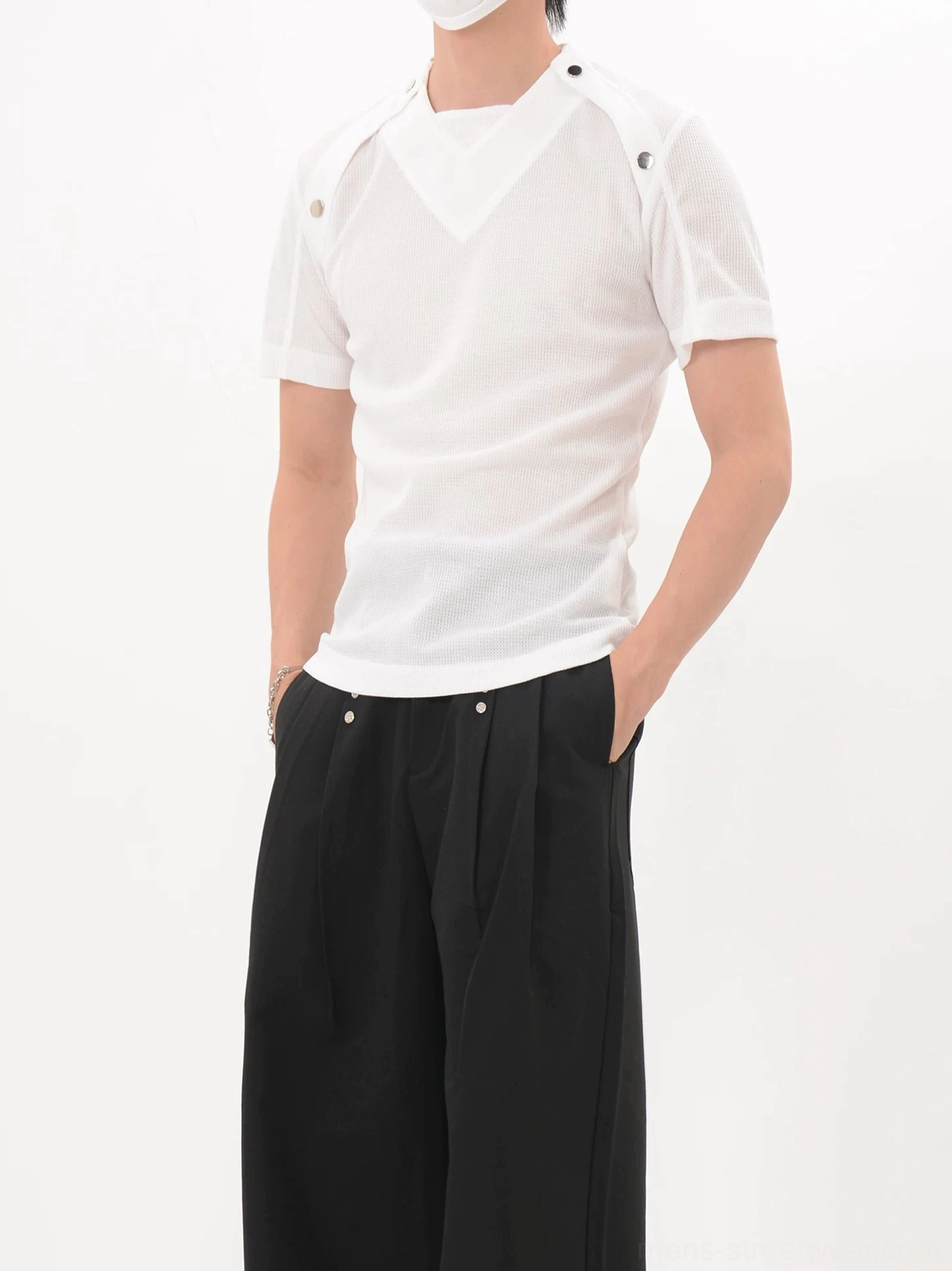 White shoulder snap fitted knit tee shown from the left front with V-shaped chest panel and minimalist Seoul streetwear styling