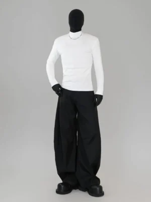 White slim mock neck long sleeve Korean streetwear base layer top styled with black wide leg trousers leather gloves and chunky shoes
