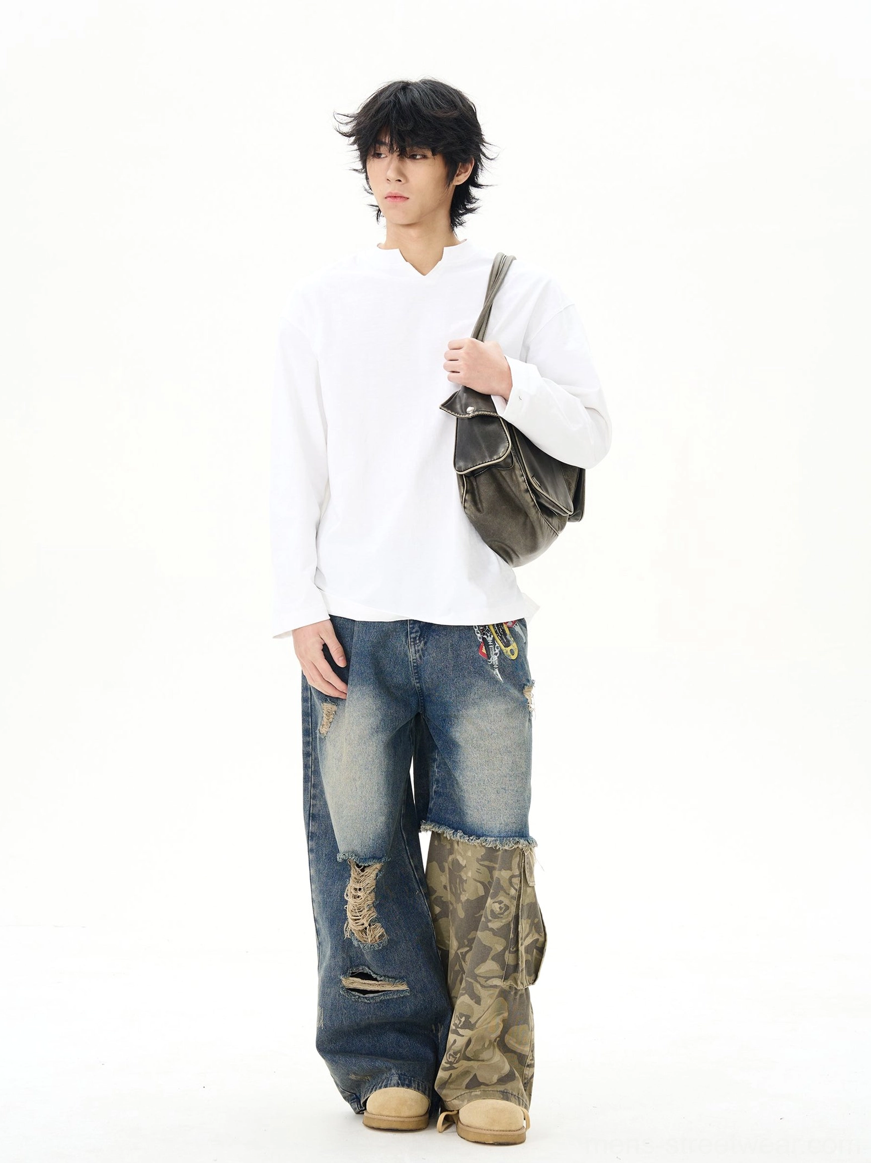 White split-neck cotton streetwear shirt styled with a dark gray crossbody bag and camo denim patchwork wide-leg pants