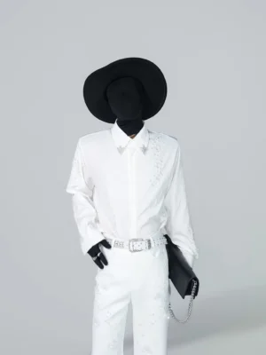 Front full-body view of a white starfall embellished shirt styled with matching wide-leg trousers, black wide-brim hat, rhinestone belt, and chain clutch