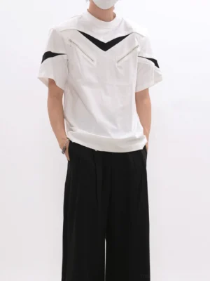 White techwear mesh zip panel T-shirt with black chevron chest stripes worn with black wide-leg pants front view