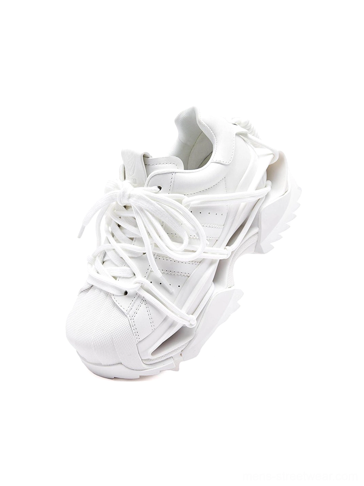 Three-quarter view of white techwear-inspired runner sneakers with decorative straps and a split sculpted chunky sole