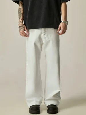 White ultra-wide leg cotton jeans front view styled with black oversized t-shirt and loafers for Seoul streetwear