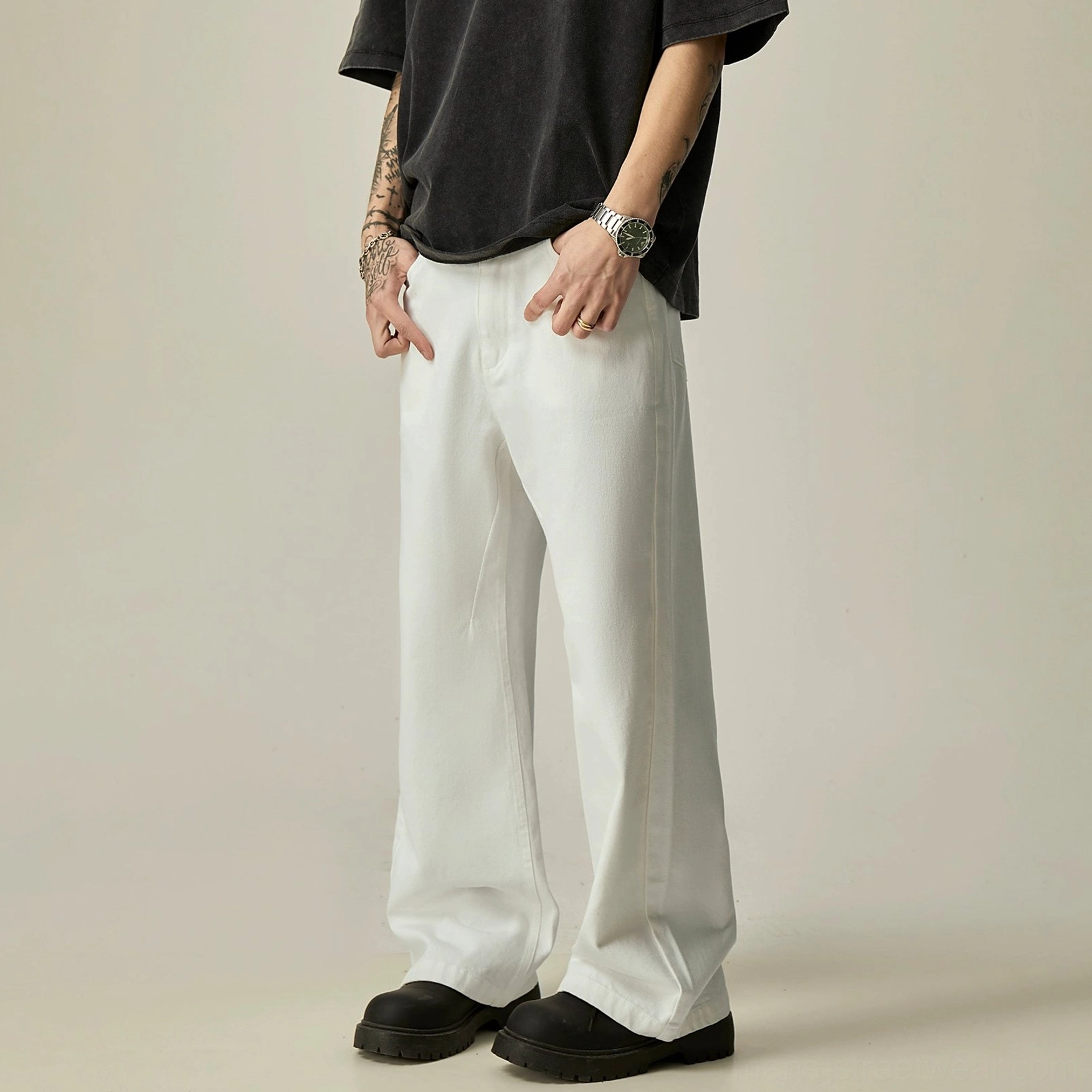 White ultra-wide leg denim jeans three-quarter front view showing clean waistband and relaxed oversized fit