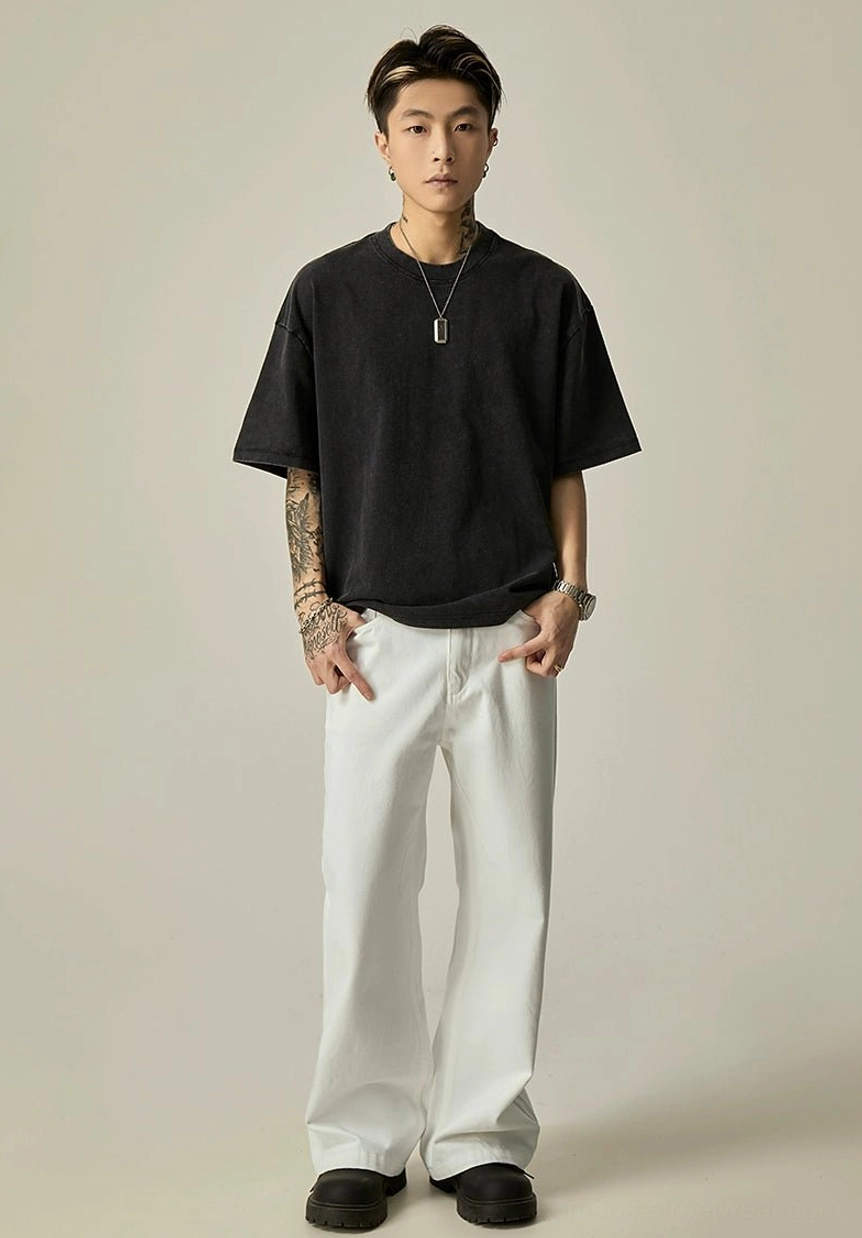 Full outfit view of white ultra-wide leg jeans paired with oversized black t-shirt in minimalist Korean streetwear style
