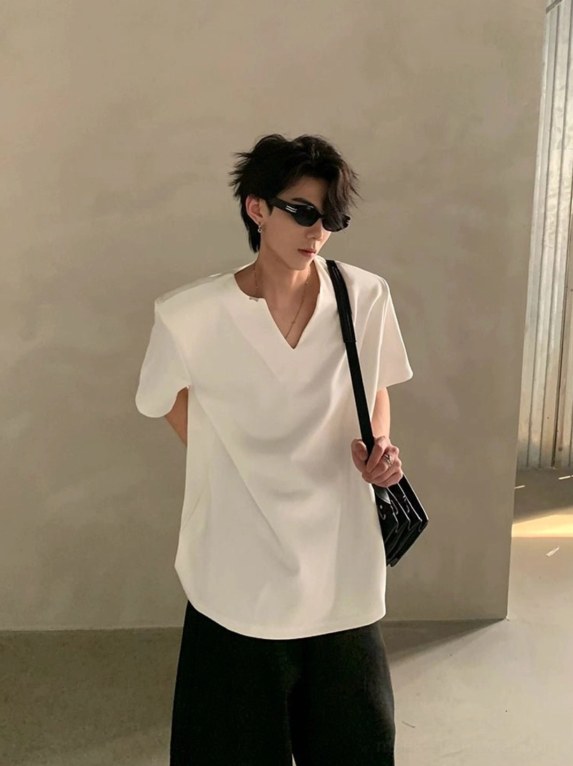 White minimalist V-notch neck short sleeve shirt styled with sunglasses and a small crossbody bag in contemporary Asian streetwear fashion