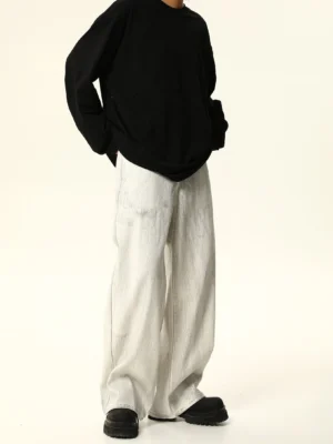 Back view of white wide leg baggy jeans showing the relaxed oversized silhouette and subtle gray acid wash finish