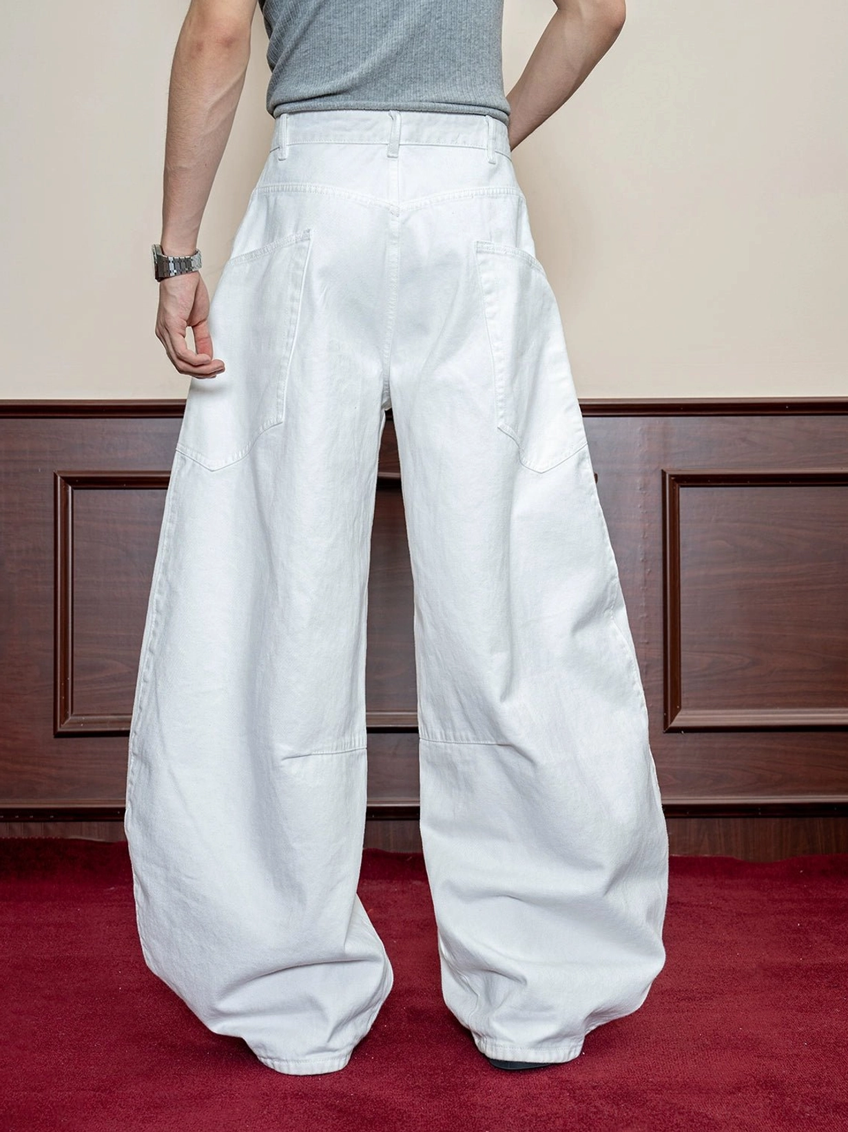 White wide leg cotton denim jeans rear view showing clean washed finish dual patch pockets and relaxed drape
