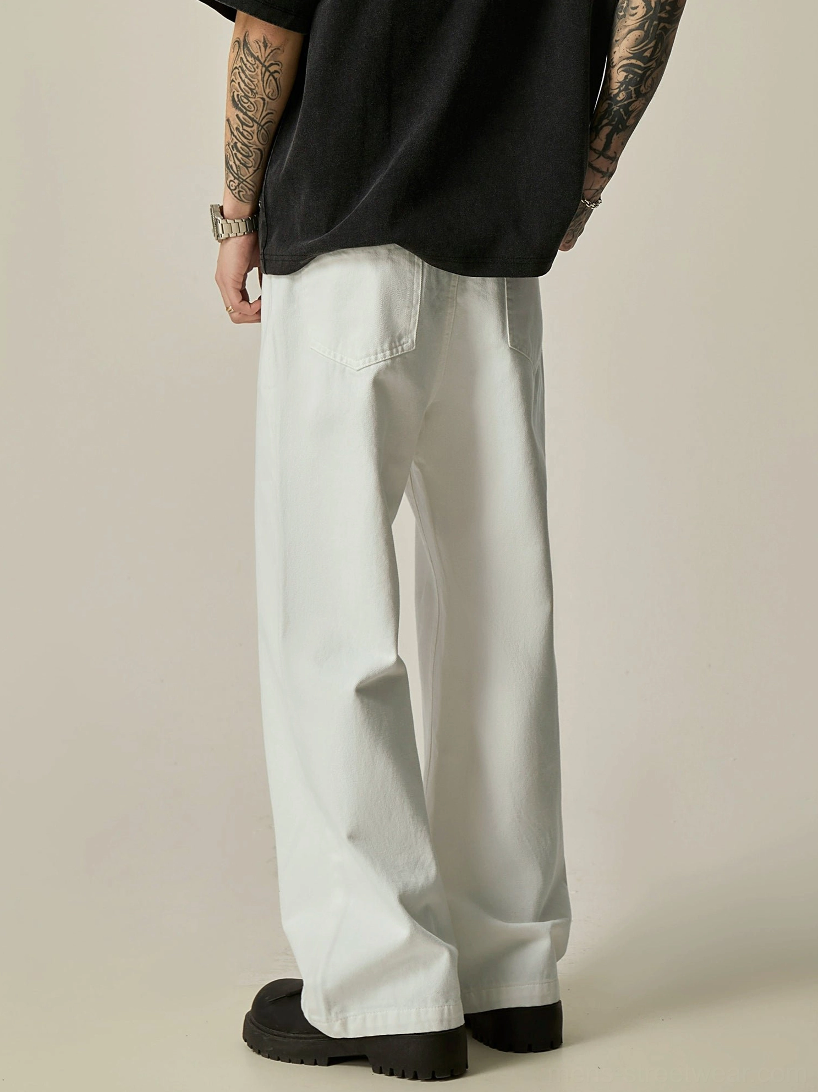 White wide-leg denim jeans back view showing relaxed straight silhouette and classic rear pockets
