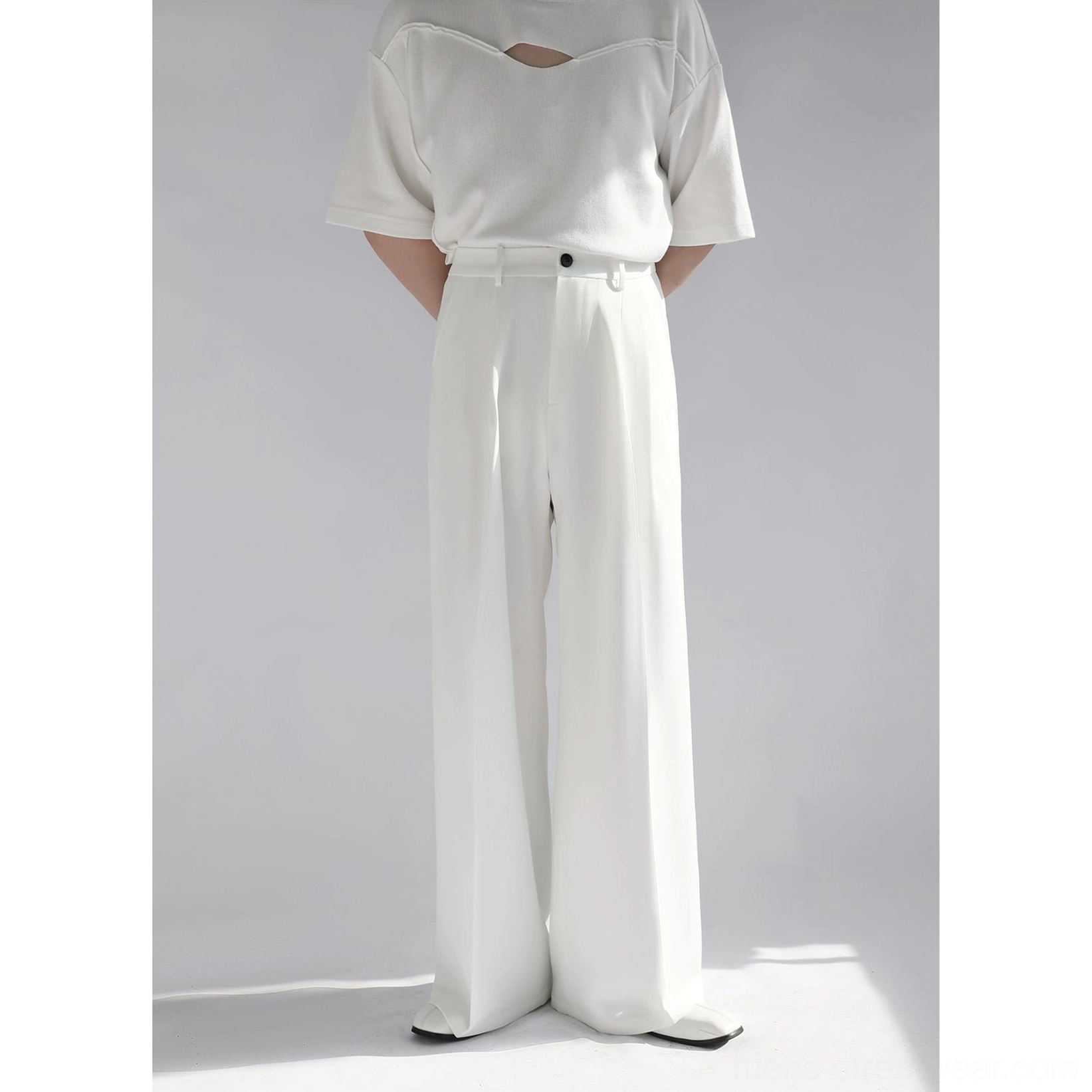 White wide leg tailored pants back full body view showing long flowing silhouette and waistband detail