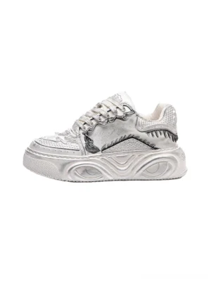 White Wukong-inspired sculpted platform sneakers shown in a left profile product view with textured upper panels and wave-molded chunky soles