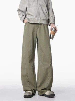 Army green wide-leg carpenter jeans with curved knee seams styled with platform shoes