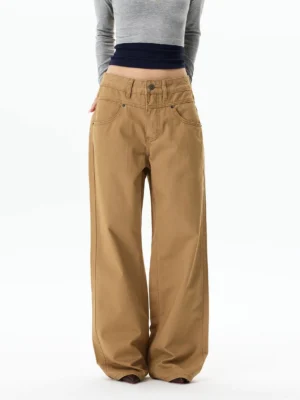 Front view of khaki wide-leg cotton chino pants styled with cropped layered tops in a relaxed Korean streetwear outfit